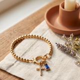 Pulseira Contas com Cruz e Cristal Azul